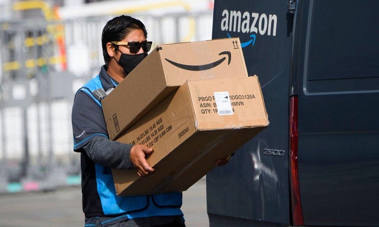 Amazon profits grow 48%; warns of slow growth